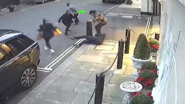 Another officer, seen on the floor, slipped over as tried to help apprehend Harket. Pic: Met Police