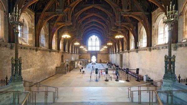 London, UK - 24 July 2010: Tourists queuing in Westminster Hall for a tour of the Houses of Parliament, which are offered when Parliament is in recession. Westminster Hall is the o<em></em>nly surviving medie<em></em>val part of the Houses of Parliament and has a famous wooden ceiling.