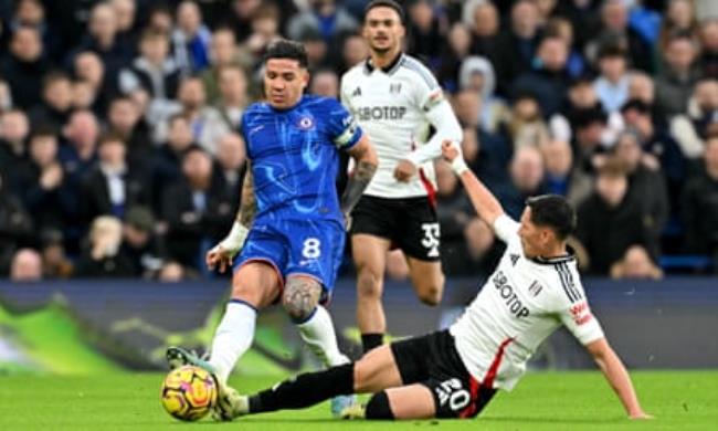 Sasa Lukic slides in to challenge Chelsea’s Enzo Fernandez during Fulham’s victory at Stamford Bridge in December.