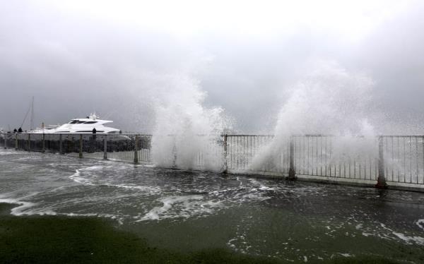 Water breaks o<em></em>nto Tamaki Drive in Auckland as Cyclone Tam brings heavy wind and rain.