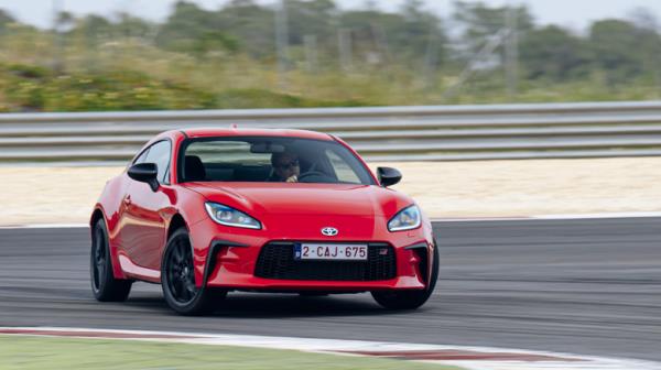 2022 Toyota GR86 drifting on track front 3/4 view